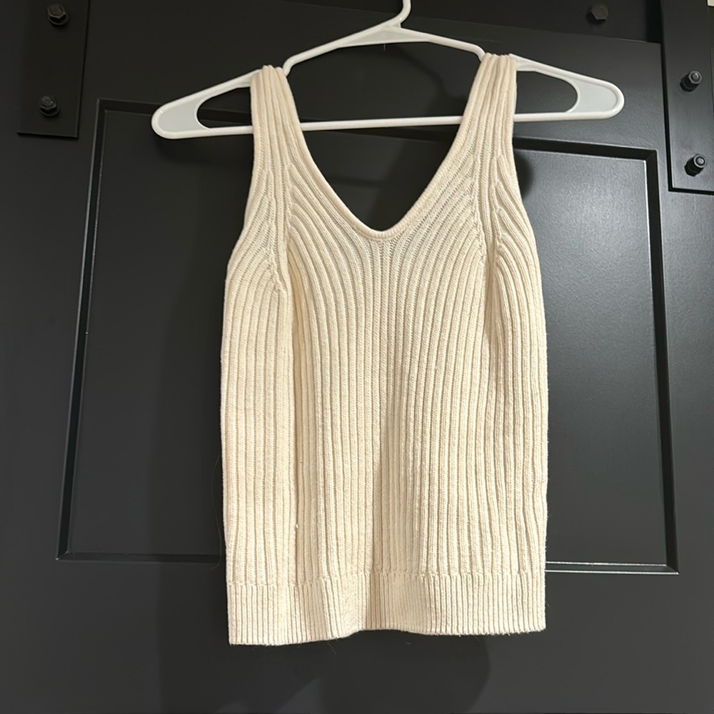 Cream tank top, sweater pattern.